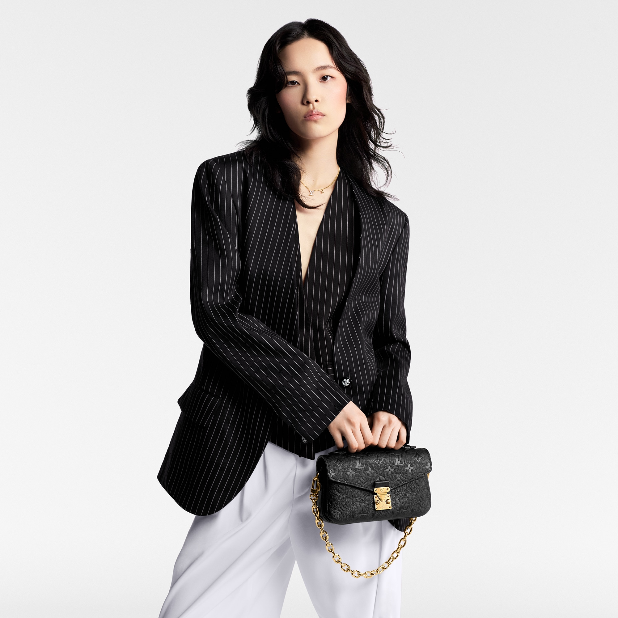 Pochette Métis East West Monogram Empreinte Leather in Women